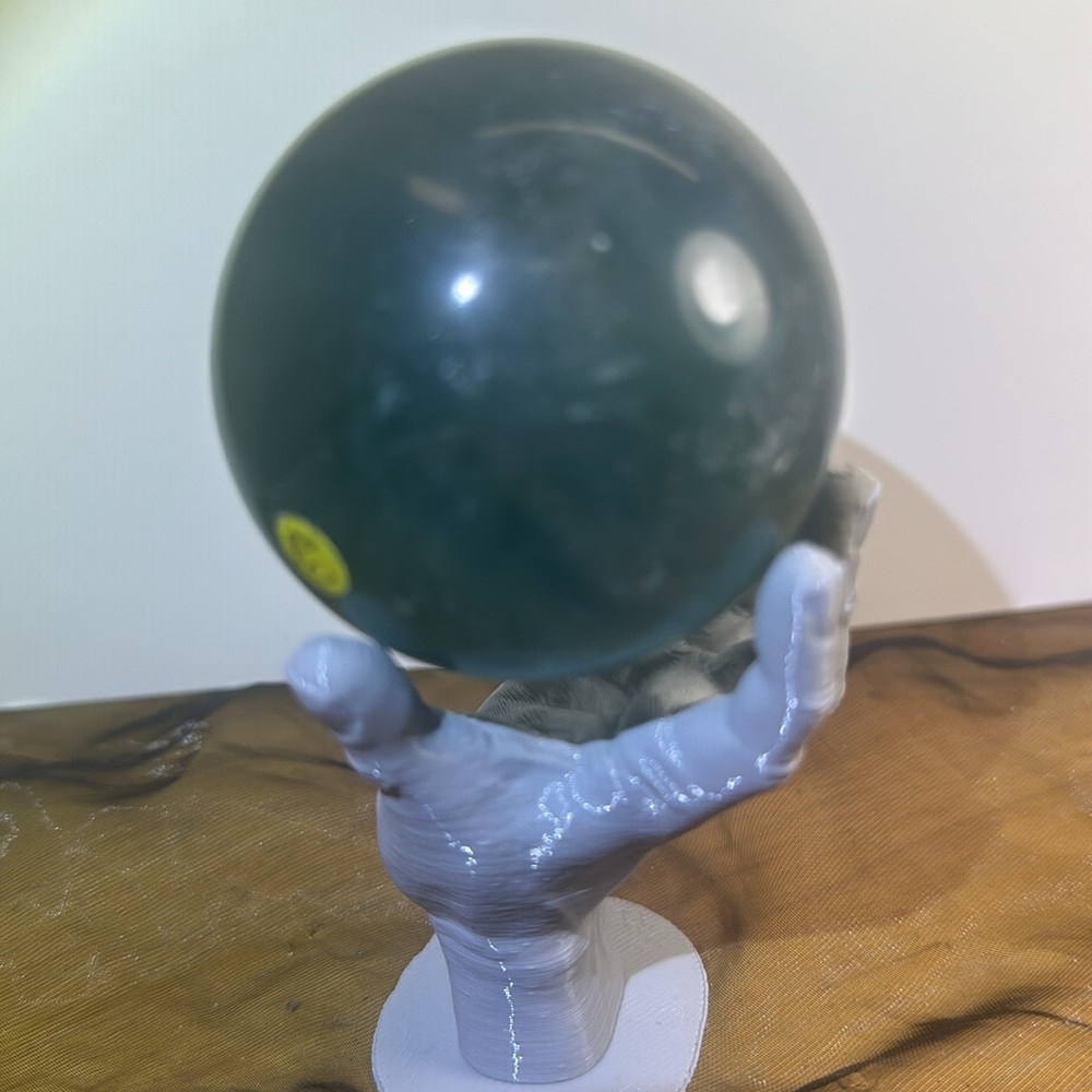 Teal green fluorite sphere. 330 g